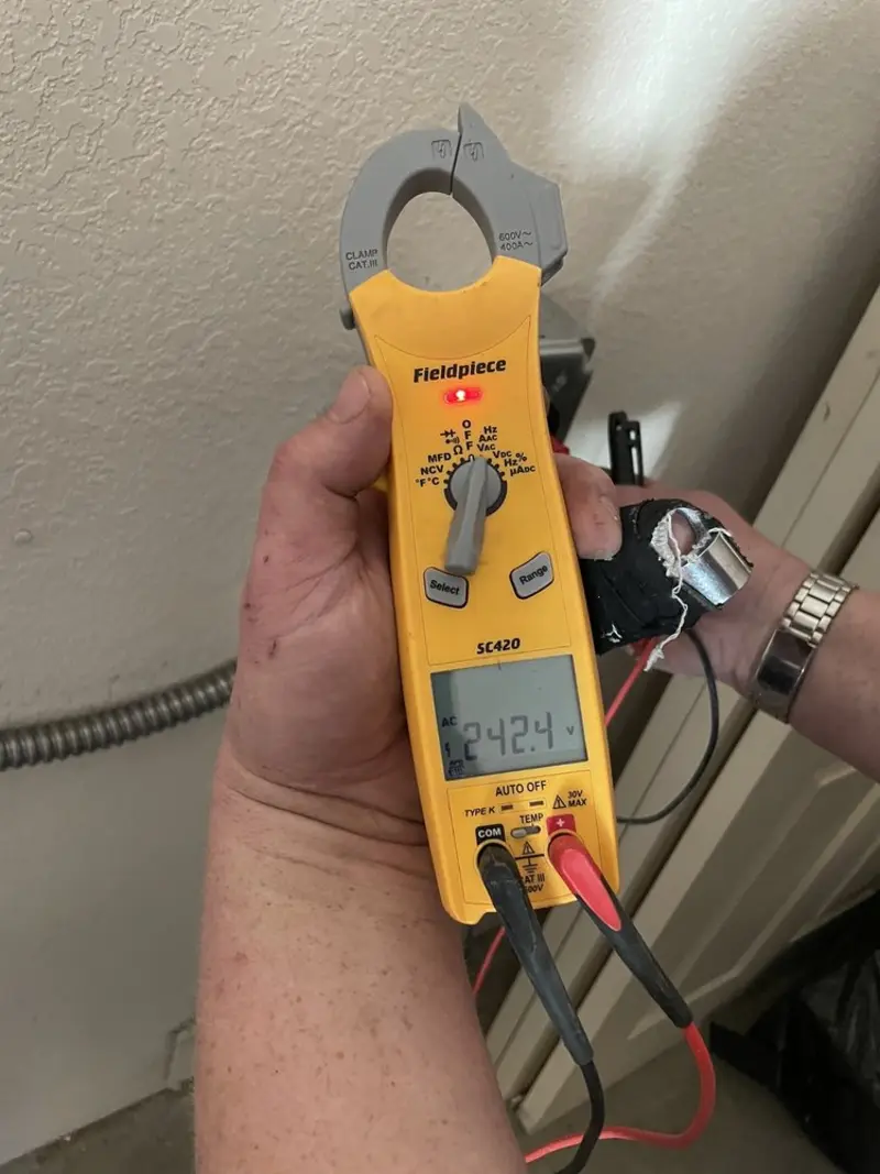 Voltage testing with clamp meter during Ceiling Fan Installation in Rollingwood